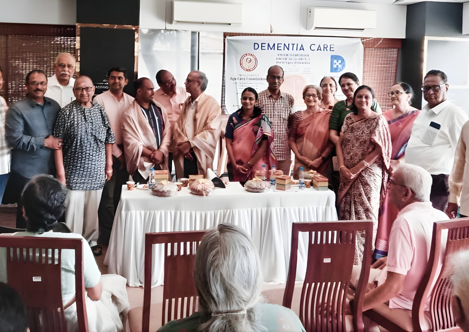 Caregiver assisting a senior woman with a puzzle.