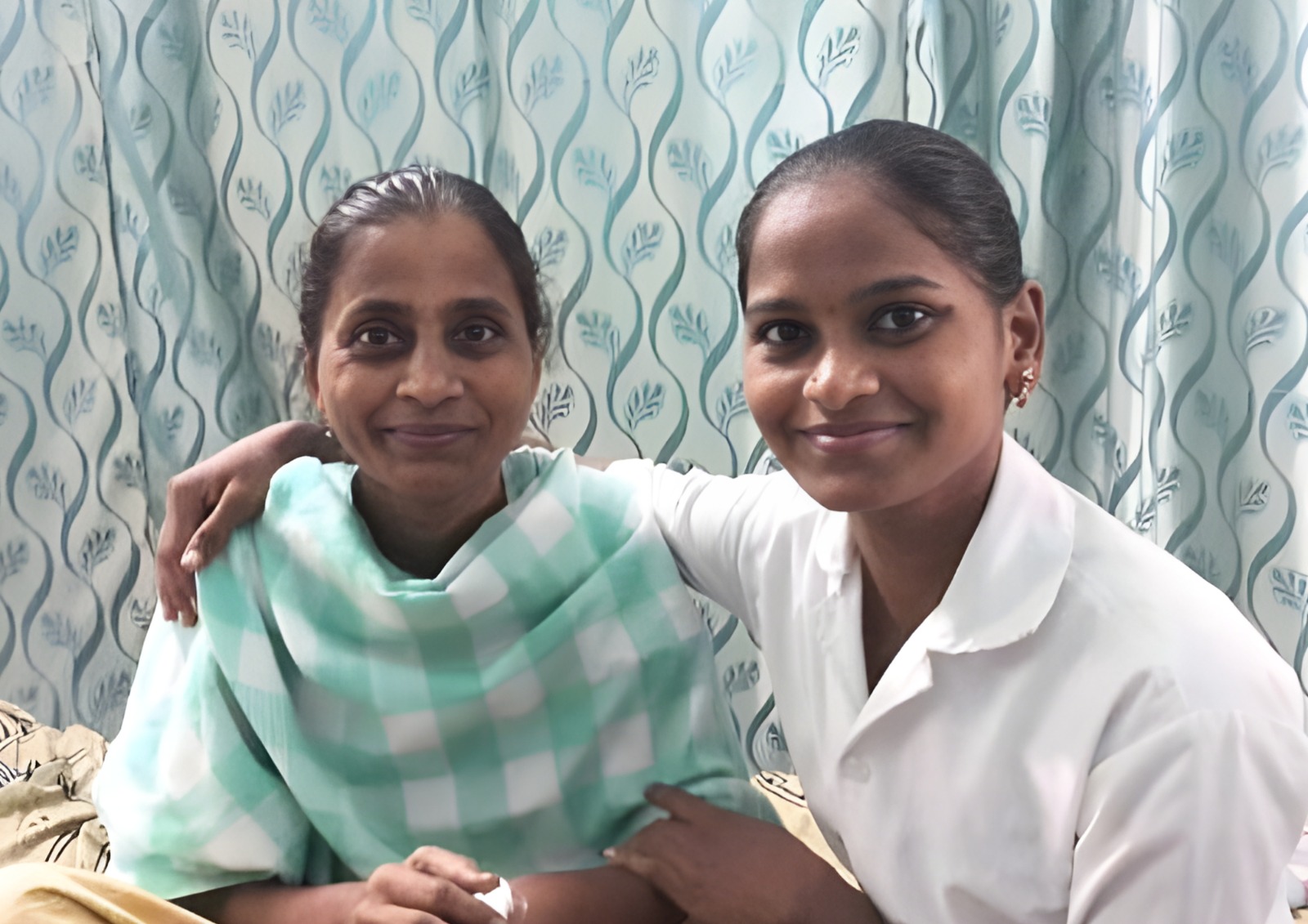 Two senior women smiling together.